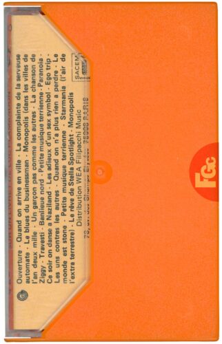 La cassette Starmania WEA 466 080 (fin 1978), coque et boîtier orange, première édition sans Besoin d'amour.