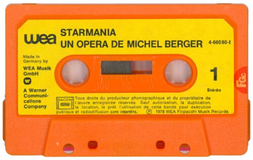 La cassette Starmania WEA 466 080 (fin 1978), coque et boîtier orange, première édition sans Besoin d'amour.